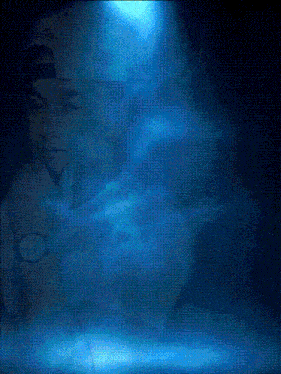 a man wearing a hat and a watch is surrounded by a blue background