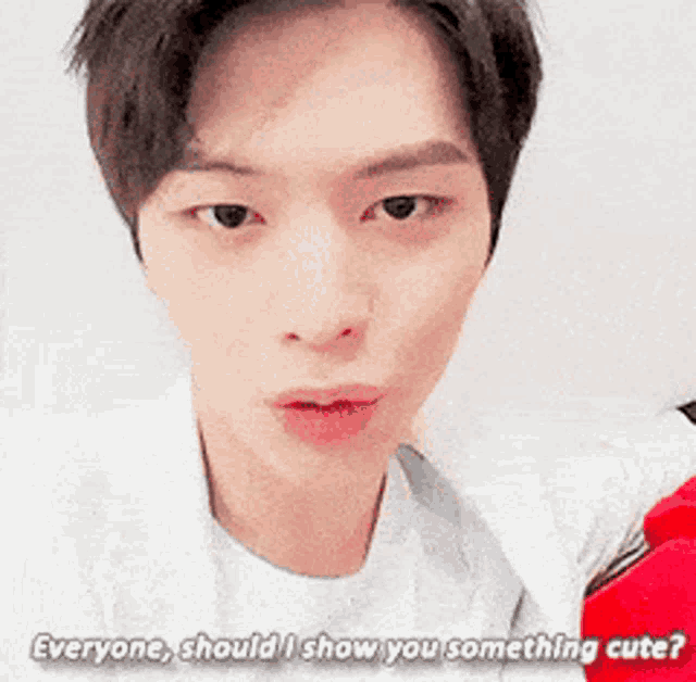 a close up of a man 's face with the words " everyone should i show you something cute "