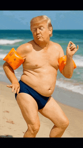 a man without a shirt is on the beach wearing a pair of orange arm floats