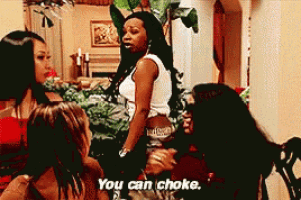 a group of women are standing in a room and one of them is saying `` you can choke '' .