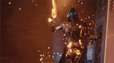 a man is holding a fireball in his hand while standing next to a door .