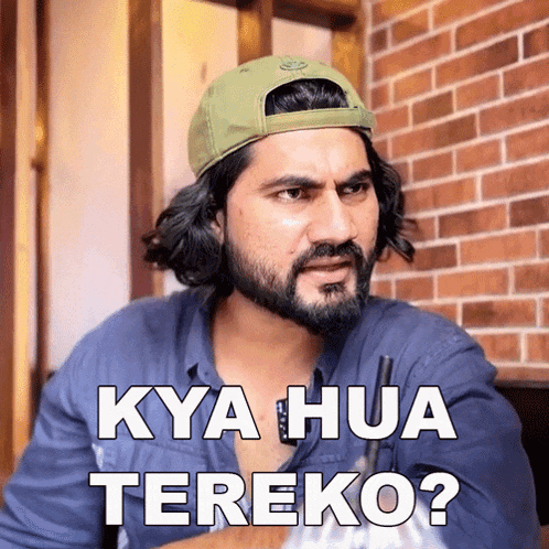 a man with a beard wearing a green hat says kya hua tereko ?