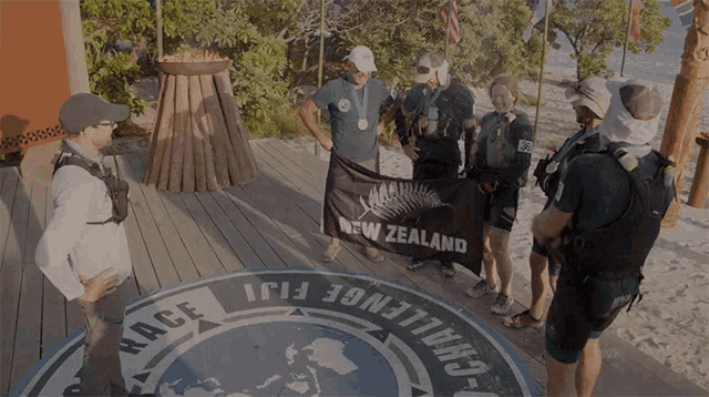 a group of people standing around a circle that says challenge