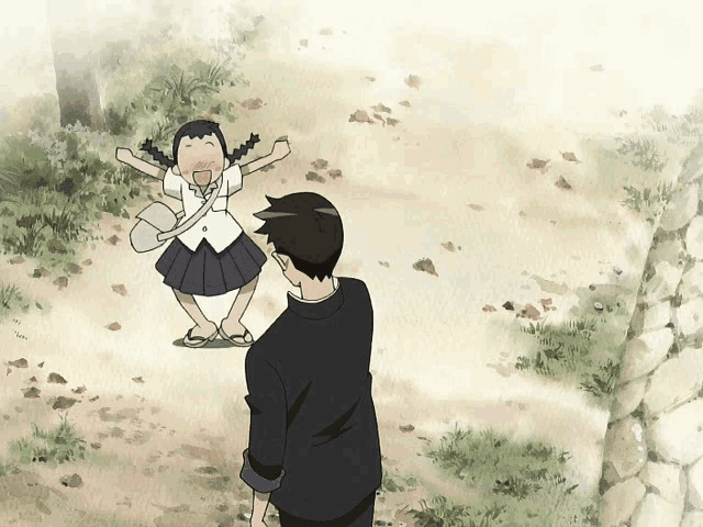 a boy and a girl are standing next to each other on a dirt path