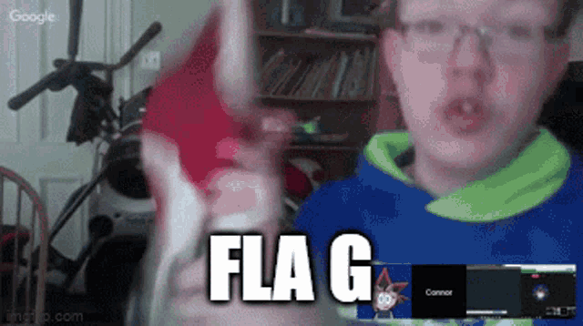a boy is holding a flag in front of a screen that says flag