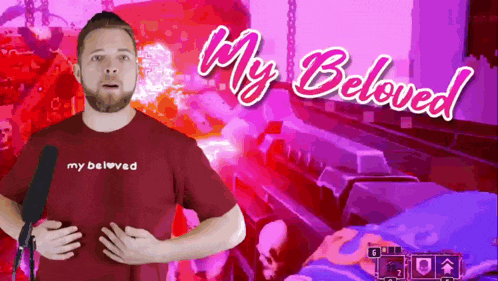 a man wearing a red shirt that says " my beloved "