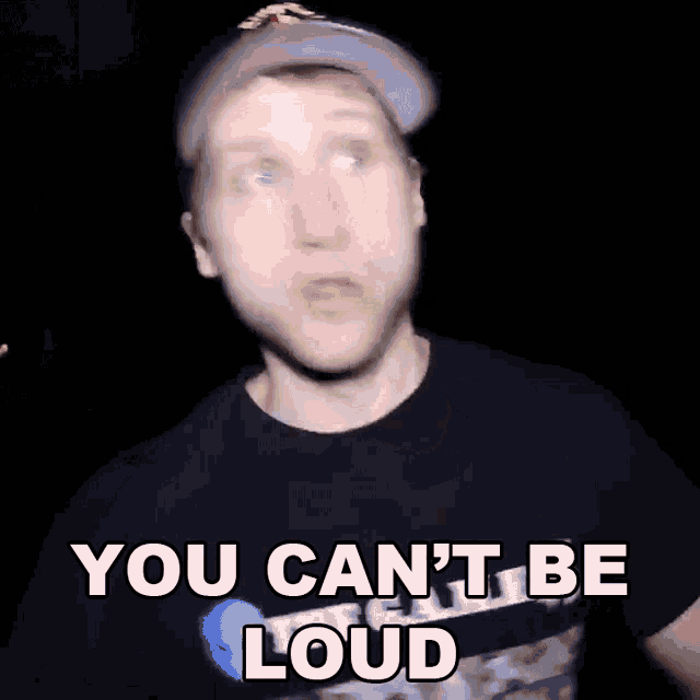 a man wearing a hat and a black shirt is saying you can 't be loud