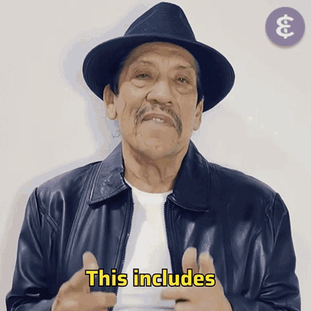 a man wearing a hat and a jacket says this includes