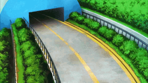 a road going through a tunnel surrounded by trees