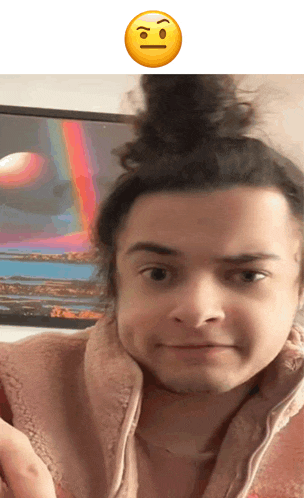a man with a bun on his head has an angry face above him