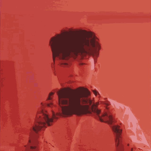 a man taking a picture of himself in a mirror
