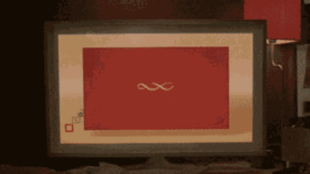 a computer monitor displays a red screen with a x on it