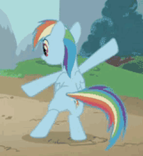 a blue pony with a rainbow tail is standing on a dirt path