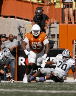a football player wearing a jersey that says texas