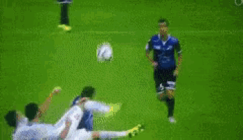 a blurry picture of a soccer game with a few advertisements in the background