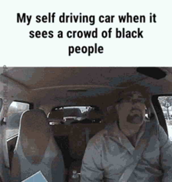 a man is sitting in a car with the words " my self driving car when it sees a crowd of black people "