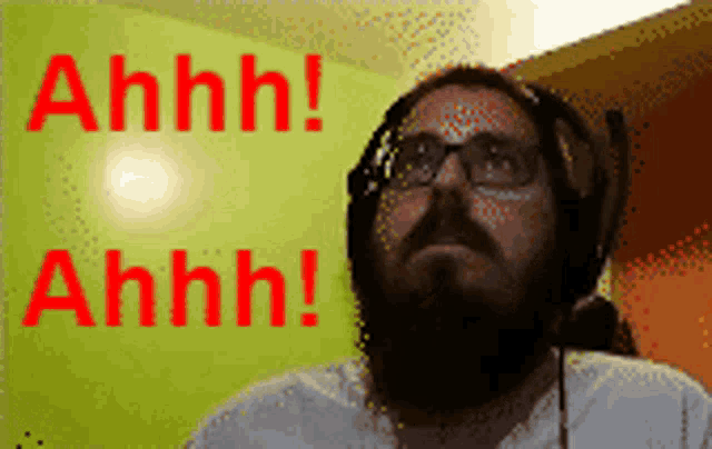 a man with a beard and headphones says ahhh in red letters