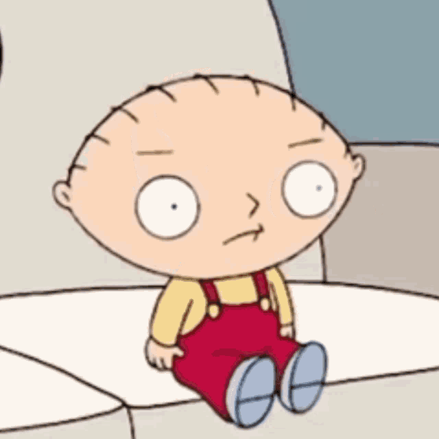 a cartoon character is sitting on a couch and making a face