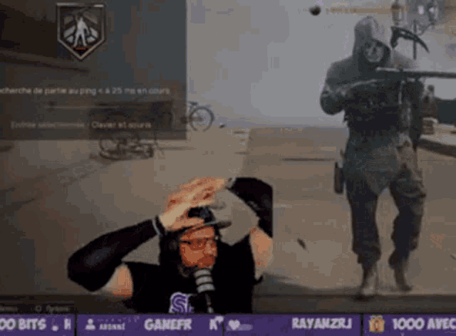 a man playing a video game with a microphone in front of a screen that says 1000 avec