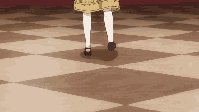 a girl in a yellow skirt and white socks walking on a checkered floor
