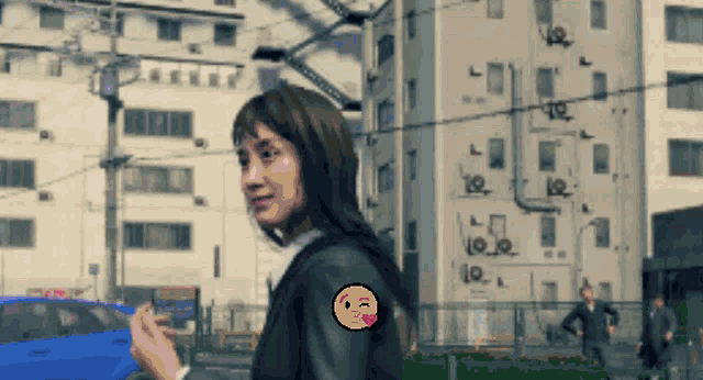 a pixel art of a woman with a smiley face on her sleeve
