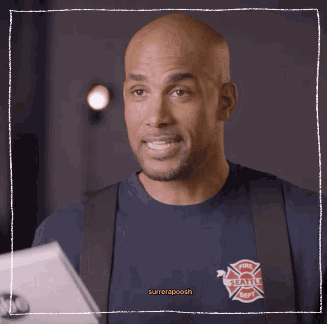 a man wearing a seattle fire department shirt