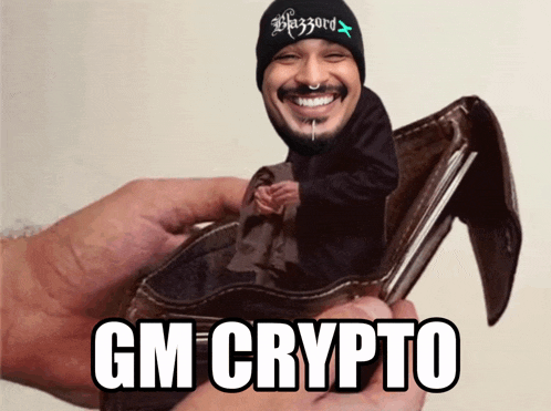 a person is holding a wallet with a picture of a man in it and the words gm crypto on the bottom