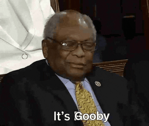 a man in a suit and tie says it 's goobby .
