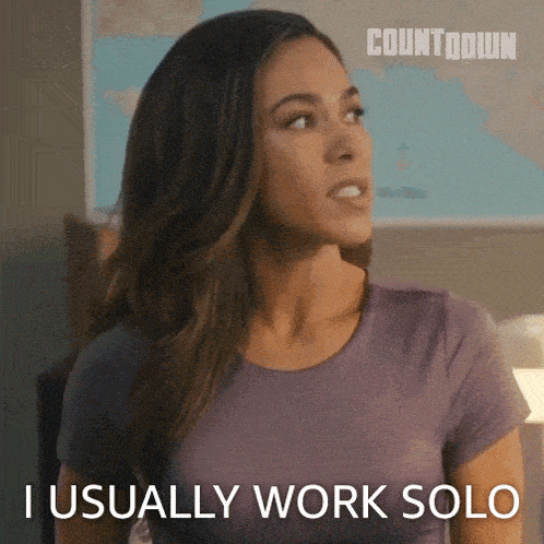a woman says i usually work solo in a purple shirt