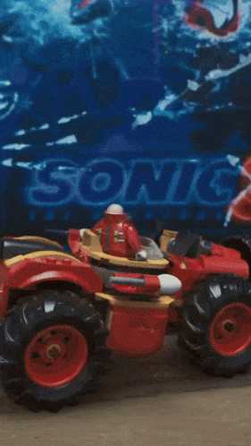 a blurred image of a sonic the hedgehog toy car