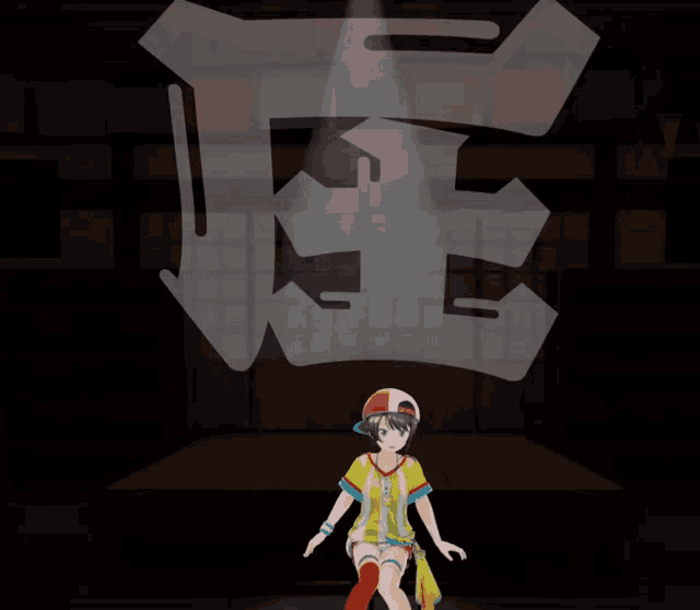 a girl in a yellow and blue shirt is standing in front of a sign that says k.e.