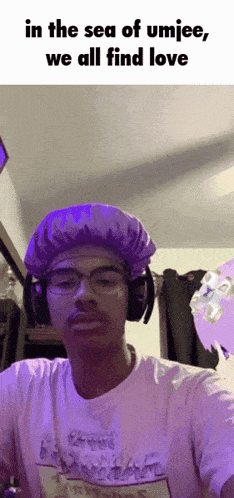 a man wearing purple headphones and a purple hat says in the sea of umjee we all find love