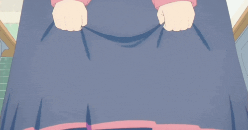 a girl in a blue skirt is standing next to a boy in a blue suit