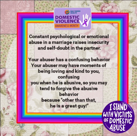 a purple sign that says i stand with victims of domestic abuse on it