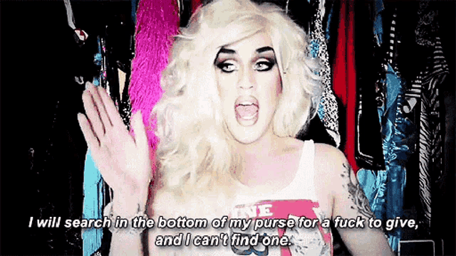 a woman in a wig is saying i will search in the bottom of my purse for a fuck to give