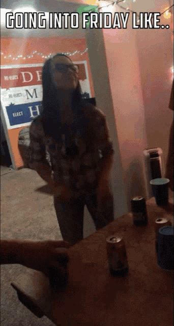 a woman is standing in front of a sign that says " going into friday like "