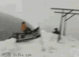 a person is upside down on a swing set in the snow .