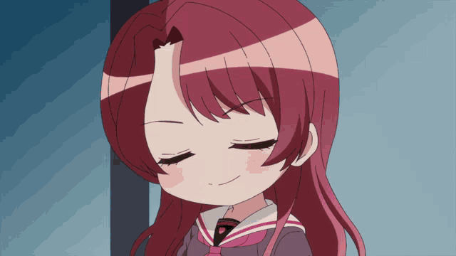 a girl with red hair is smiling with her eyes closed and the letter p is on her shirt