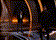 a blurry picture of a ferris wheel at night with a lot of lights on it .