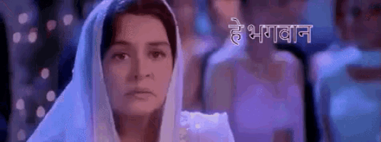 a woman with a veil on her head is standing in front of a sign that says ' he ghanan ' on it