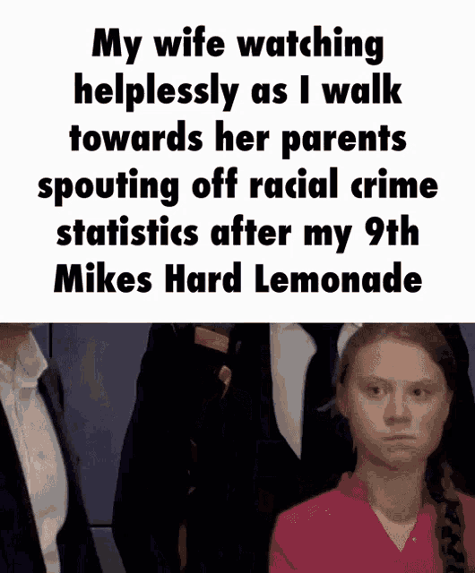 a woman in a pink shirt is standing in front of a man in a suit and tie