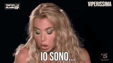 a blonde woman is making a funny face and saying `` i 'm sorry '' .