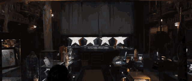 a dark room with a sign that says " our place hotel apollo hotel "