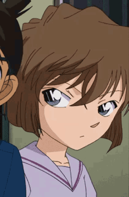 a close up of a girl 's face with a blue eye