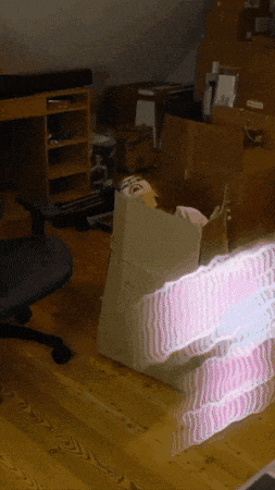 a cardboard box is sitting on the floor in a room