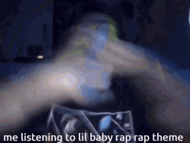 a blurry picture of a person 's hand with the words me listening to lil baby rap rap theme