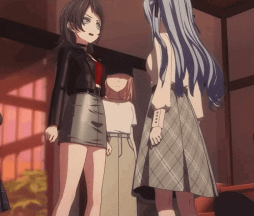 a group of anime girls standing in a room