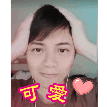 a man with chinese writing on his face holds his head in his hands