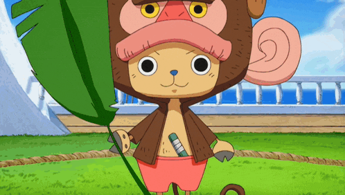 tony tony chopper from one piece is holding a green leaf in his hand