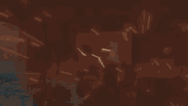 a blurry picture of a person holding a gun in a dark room